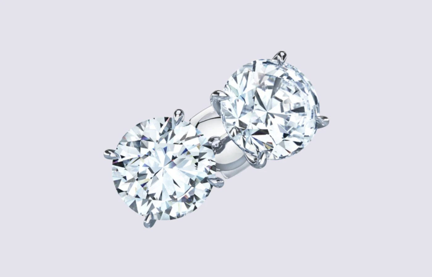Par enstens diamantøredobber i hvitt gull med 4-klossetting og 2 x 1 carat diamanter