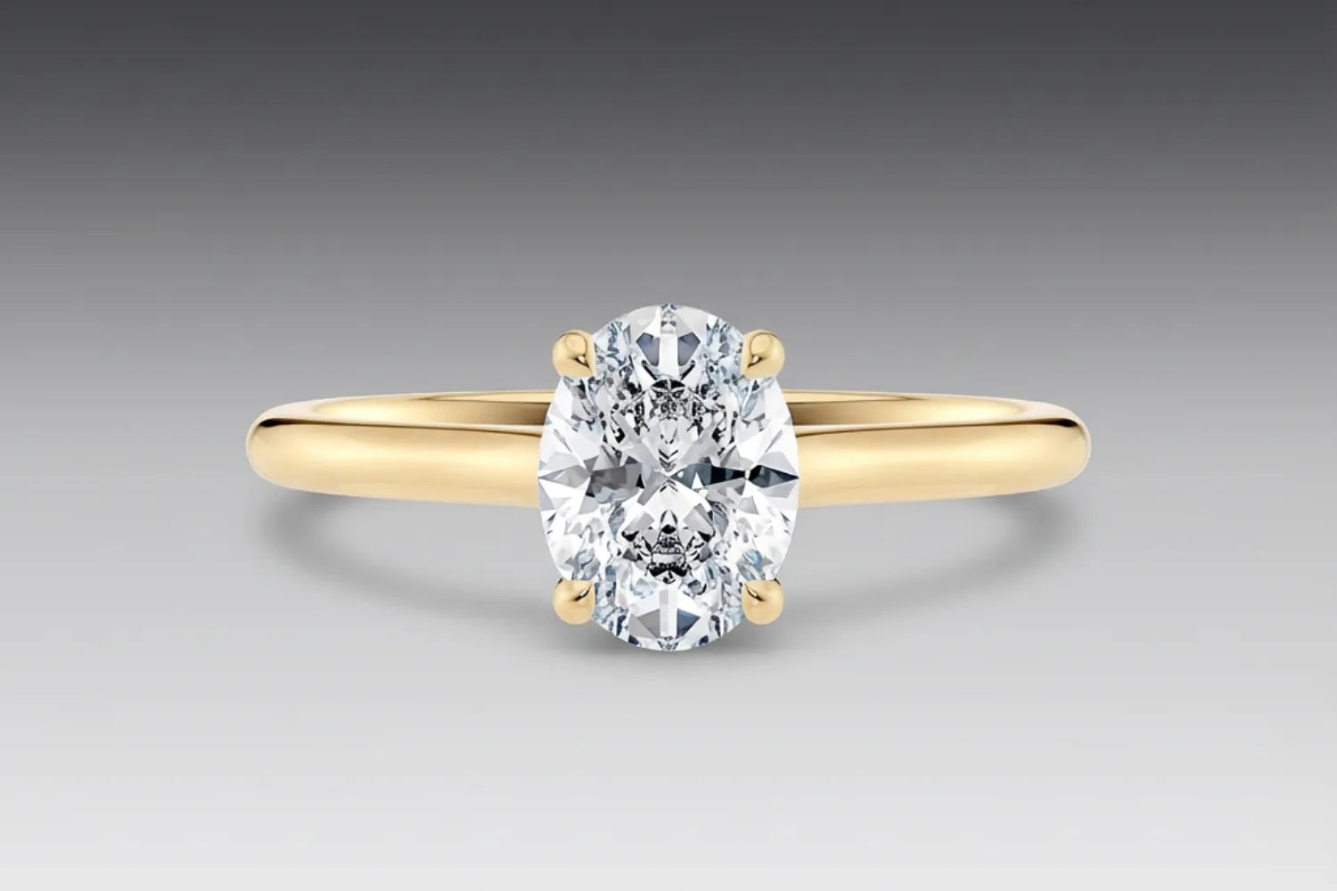 forlovelsesringer gult gull – en med oval diamant og en med dråpeformet diamant side om side. Lab-dyrkede diamanter fra Hartwell.