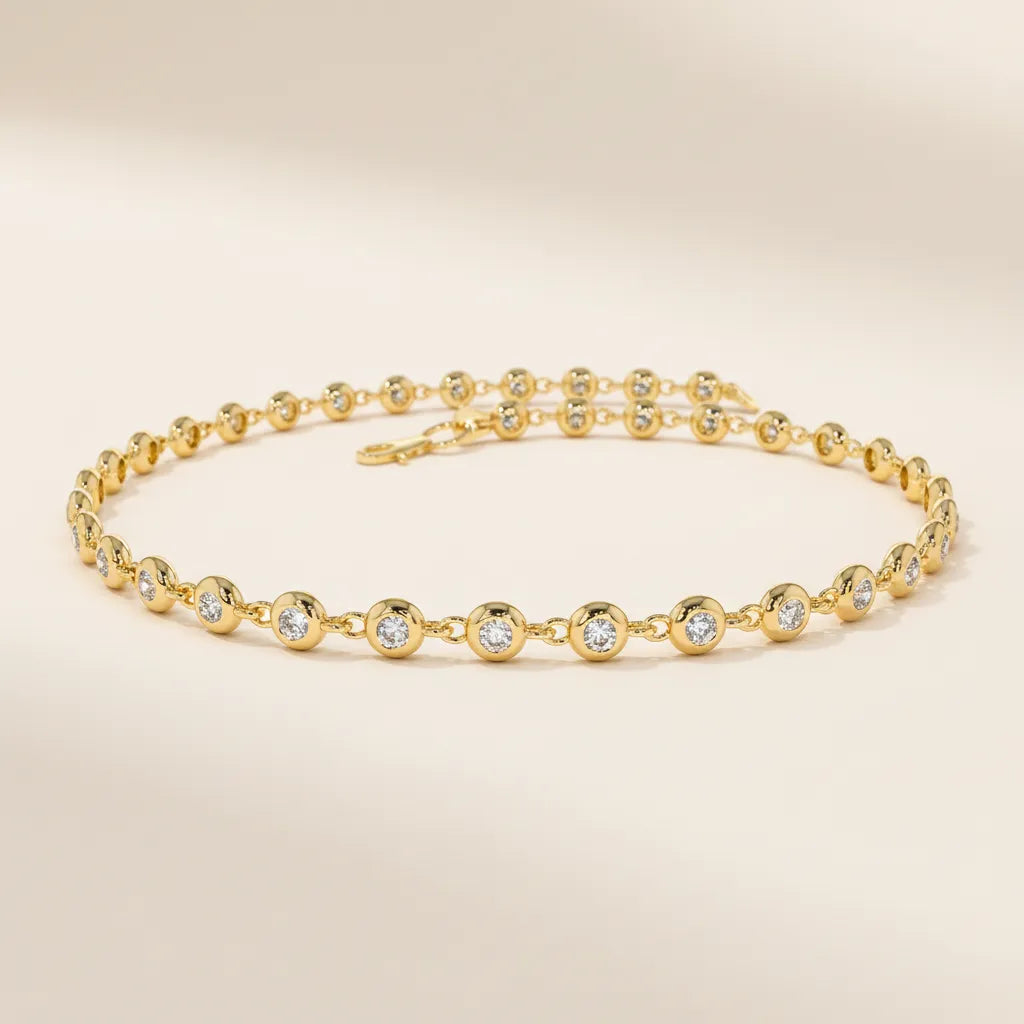 Diamantarmbånd i gult gull med bezel-fattet rund lab-diamant, brukt som hovedbilde for kolleksjonen “Diamantarmbånd”.