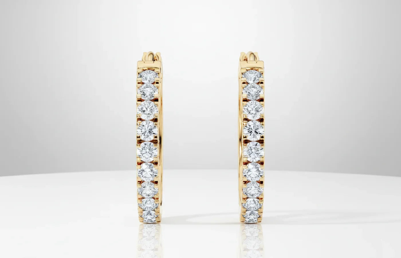 Elegante øreringer i gull med diamanter i gull fra Hartwell