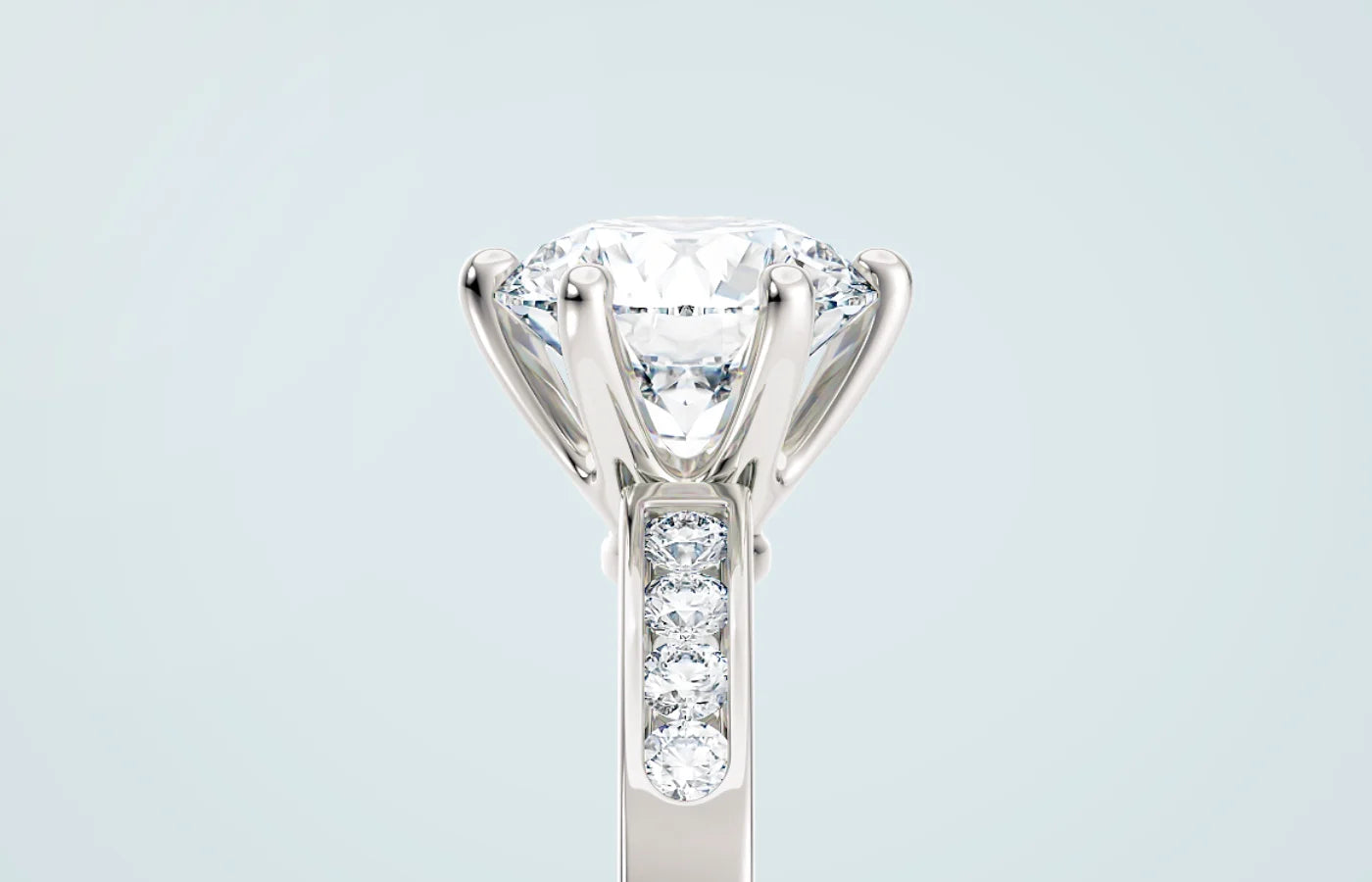 Diamantring med kanalinnfatning sett i profil – lab-diamanter satt tett i gullring fra Hartwell