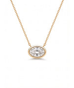 Oval diamanthalskjede i bezelinnfatning, 14K gult gull.